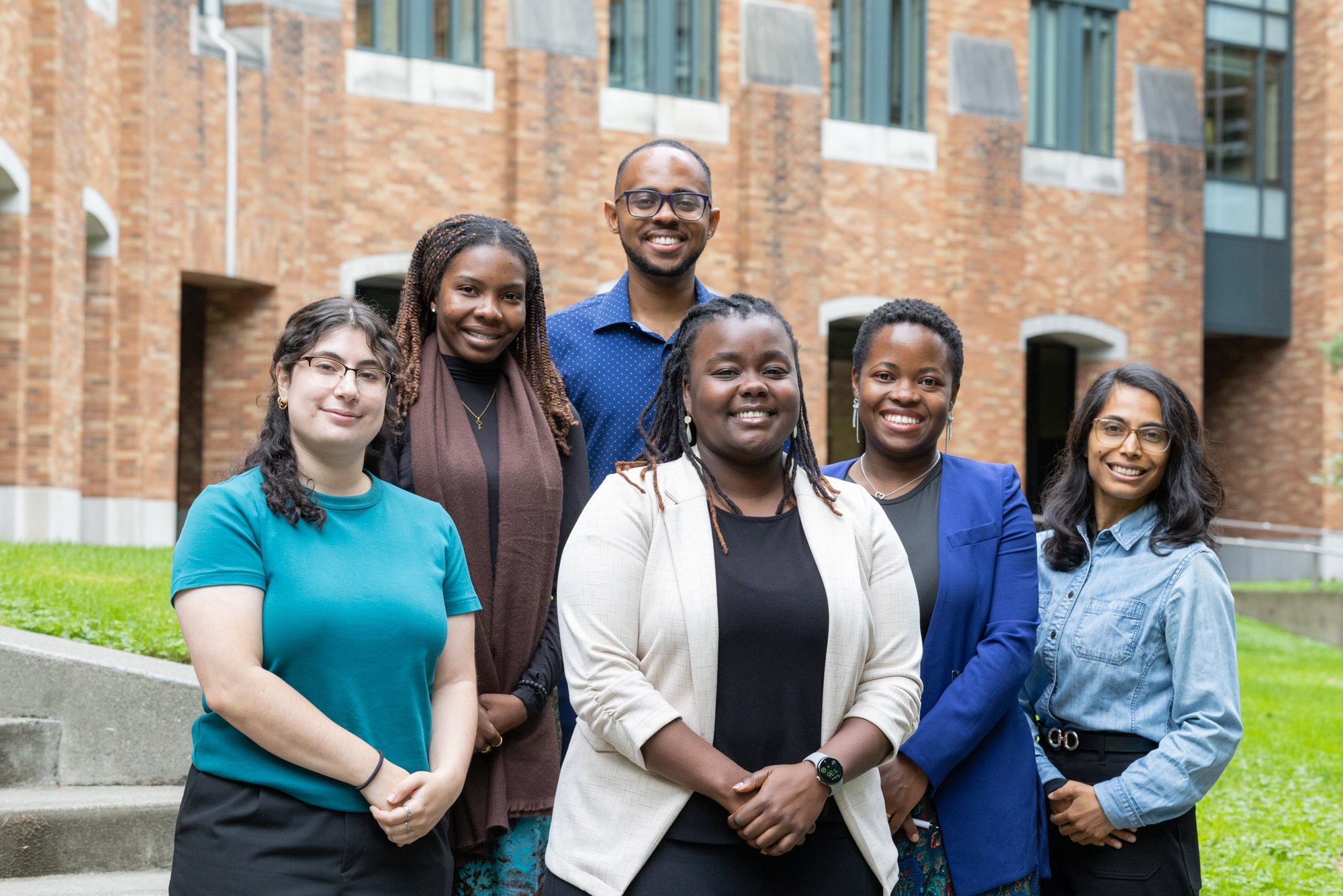Six members of the IDEAS research group together outside a University of Washington building